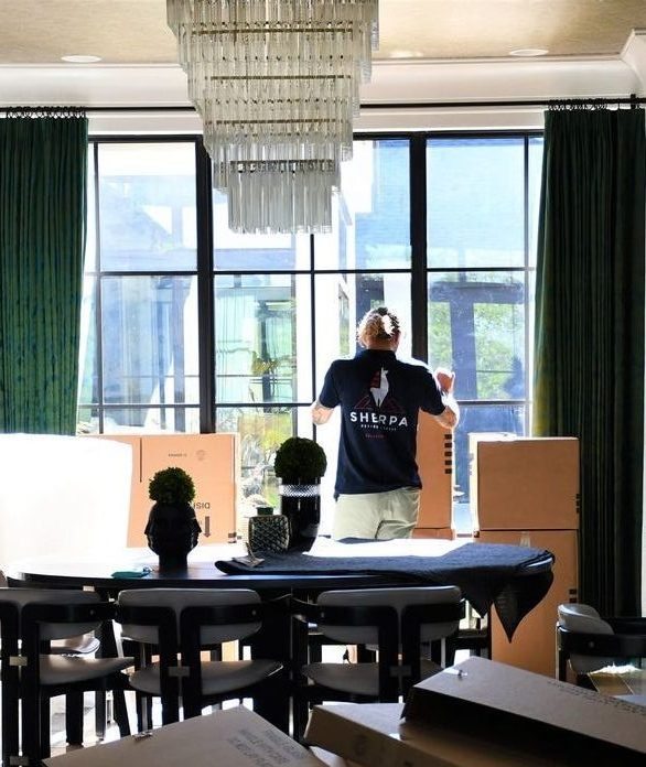 man in beautifully decorated room with moving boxes