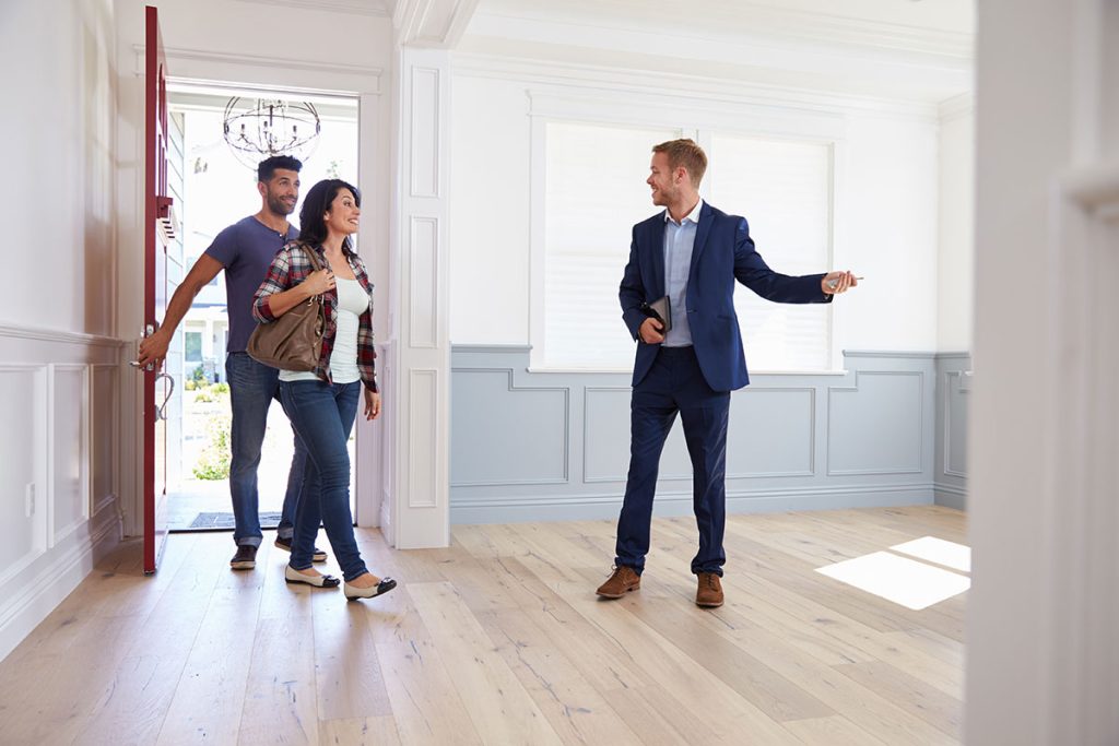 realtor showing house to couple